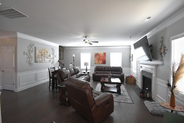 190 Colfax Dr, Boiling Springs, SC 29316 - living area with a decorative wall, a ceiling fan, a fireplace, crown molding, and dark wood-style flooring