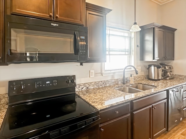 739 Shelburne Ln, Lyman, SC 29365 - kitchen featuring black appliances, light stone countertops, and decorative light fixtures