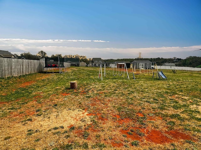 739 Shelburne Ln, Lyman, SC 29365 - fenced backyard featuring a trampoline and a playground
