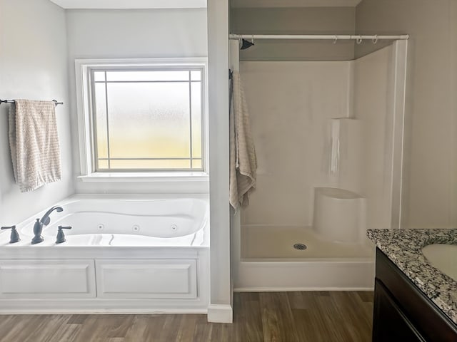 739 Shelburne Ln, Lyman, SC 29365 - full bathroom featuring a whirlpool tub, vanity, a shower, and wood finished floors