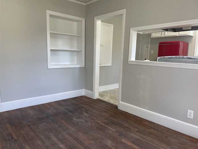 126 White Oak Rd, Spartanburg, SC 29301 - unfurnished room with wood finished floors, built in shelves, and ornamental molding