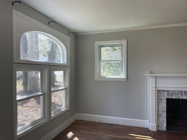 126 White Oak Rd, Spartanburg, SC 29301 - unfurnished living room with dark wood-style floors, a brick fireplace, and crown molding