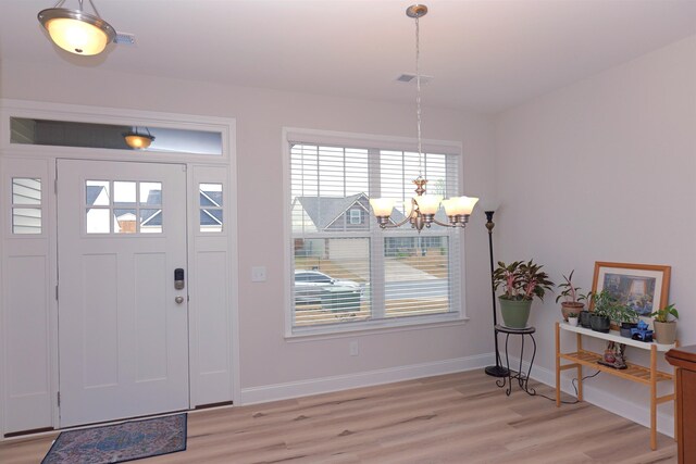 2054 Lachaise Ln, Moore, SC 29369 - foyer with a chandelier and light wood-style floors