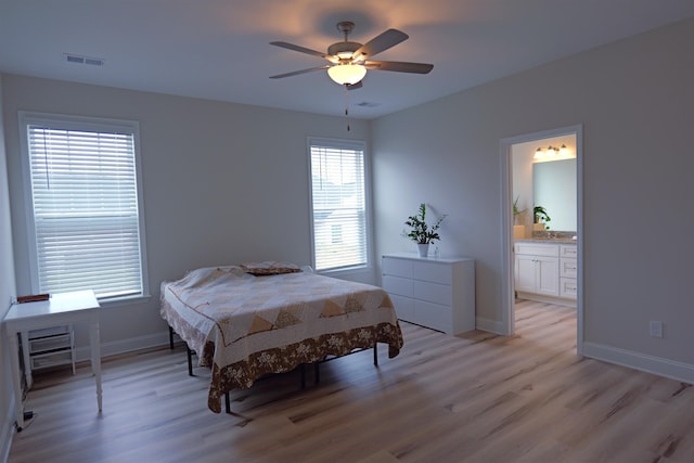 2054 Lachaise Ln, Moore, SC 29369 - bedroom with light wood-style floors, connected bathroom, and ceiling fan