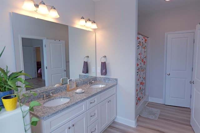 2054 Lachaise Ln, Moore, SC 29369 - full bath with wood finished floors, double vanity, and a shower with curtain