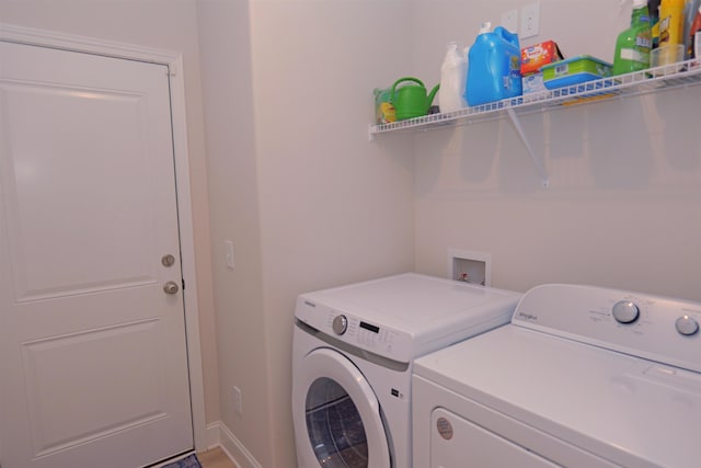 2054 Lachaise Ln, Moore, SC 29369 - washroom featuring washing machine and clothes dryer and baseboards