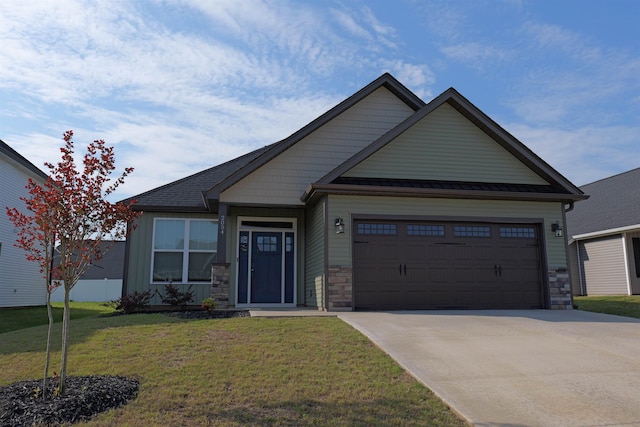 2054 Lachaise Ln, Moore, SC 29369 - view of front of home with an attached garage, stone siding, driveway, and a front yard