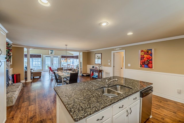 423 Coggins Shore Rd, Inman, SC 29349 - kitchen with stainless steel dishwasher, ornamental molding, wainscoting, dark wood-style floors, and a center island with sink