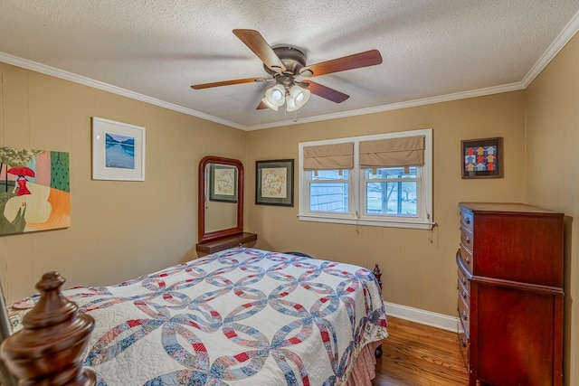 423 Coggins Shore Rd, Inman, SC 29349 - bedroom with wood finished floors, ornamental molding, a textured ceiling, and a ceiling fan