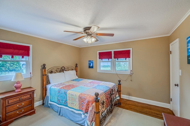 423 Coggins Shore Rd, Inman, SC 29349 - bedroom with crown molding, wood finished floors, a textured ceiling, and a ceiling fan