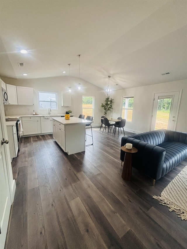 776 Darwin Rd, Gaffney, SC 29340 - kitchen with range with electric cooktop, dark wood finished floors, light countertops, a center island, and vaulted ceiling