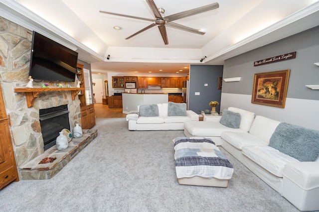 316 Whitfield Ln, Boiling Springs, SC 29316 - living area with ceiling fan, a raised ceiling, a stone fireplace, light colored carpet, and recessed lighting