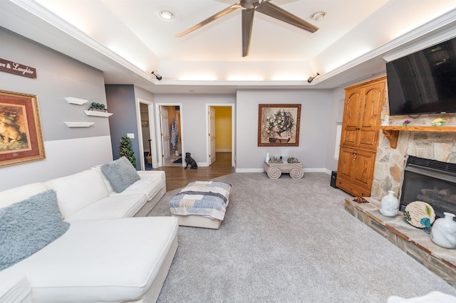 316 Whitfield Ln, Boiling Springs, SC 29316 - living area featuring a raised ceiling, a ceiling fan, carpet flooring, and a stone fireplace