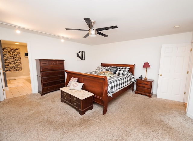 316 Whitfield Ln, Boiling Springs, SC 29316 - bedroom with rail lighting, light colored carpet, ceiling fan, and ensuite bath