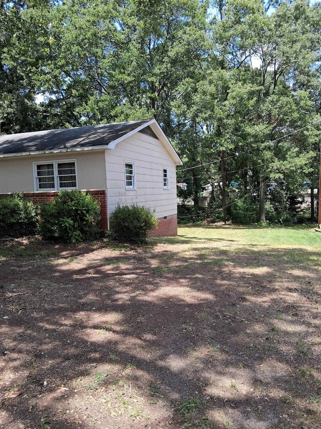 109 Shoally, Boiling Springs, SC 29316 - view of side of home featuring brick siding, crawl space, and view of wooded area