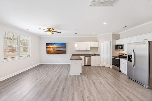 119 N Moore St, Duncan, SC 29334 - kitchen with appliances with stainless steel finishes, crown molding, dark countertops, ceiling fan, and white cabinetry