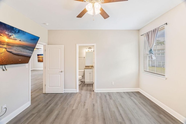 119 N Moore St, Duncan, SC 29334 - unfurnished bedroom with light wood-style flooring, connected bathroom, and a ceiling fan