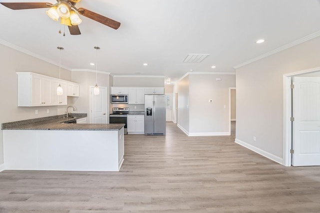 119 N Moore St, Duncan, SC 29334 - kitchen featuring stainless steel appliances, recessed lighting, light wood finished floors, ornamental molding, and white cabinetry