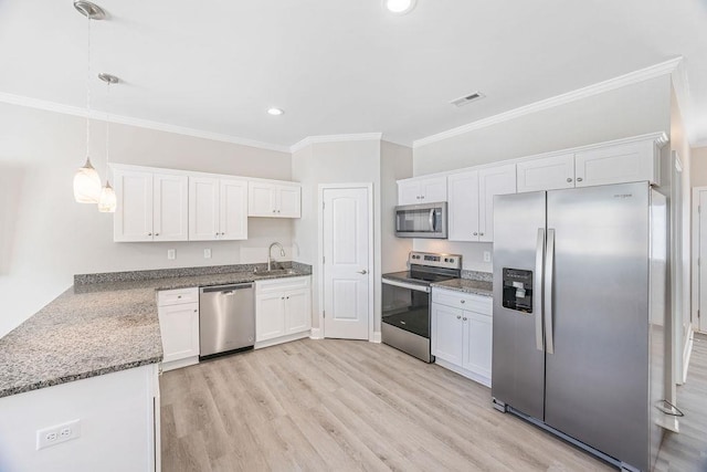 119 N Moore St, Duncan, SC 29334 - kitchen with stainless steel appliances, ornamental molding, white cabinets, dark stone countertops, and recessed lighting