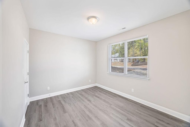 119 N Moore St, Duncan, SC 29334 - empty room featuring wood finished floors and baseboards