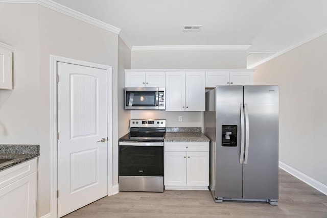 121 N Moore St, Duncan, SC 29334 - kitchen featuring stainless steel appliances, white cabinets, light wood-type flooring, and ornamental molding