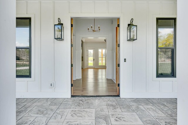 164 Triangle Pine Rd, Fountain Inn, SC 29644 - view of exterior entry with board and batten siding and covered porch