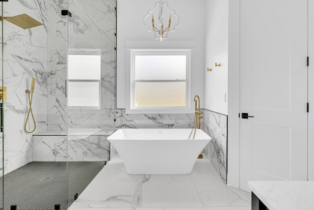 164 Triangle Pine Rd, Fountain Inn, SC 29644 - full bath featuring a soaking tub, a marble finish shower, a chandelier, marble tiled flooring, and a wainscoted wall