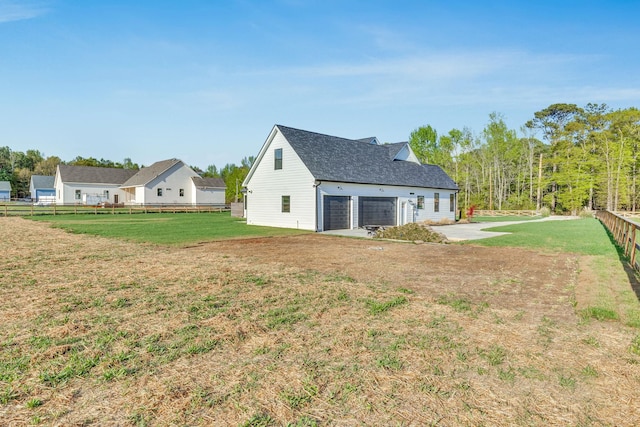 164 Triangle Pine Rd, Fountain Inn, SC 29644 - back of property featuring a garage and a shingled roof