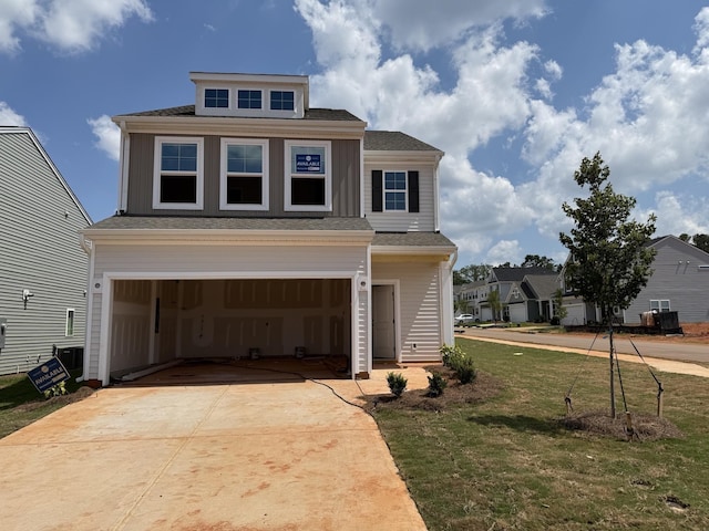 2397 Mill Loop, Spartanburg, SC 29301 - view of front of property featuring a garage, driveway, a front yard, and a shingled roof