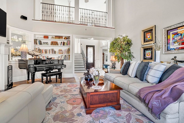10 Torrey Pines Ct, Spartanburg, SC 29306 - living area with a towering ceiling, stairs, and wood finished floors