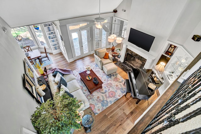 10 Torrey Pines Ct, Spartanburg, SC 29306 - living room featuring wood finished floors, a premium fireplace, a ceiling fan, and a high ceiling