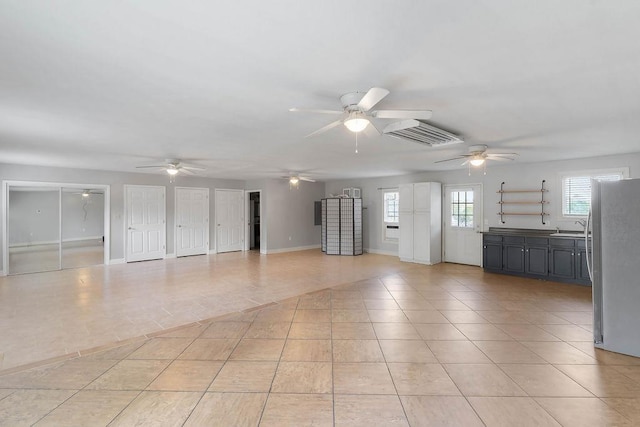 1620 Rainbow Lake Rd, Inman, SC 29349 - unfurnished living room with ceiling fan and light tile patterned floors