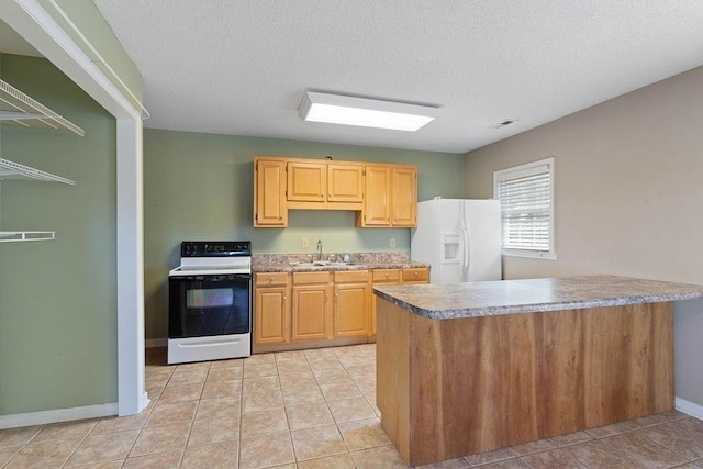 1620 Rainbow Lake Rd, Inman, SC 29349 - kitchen with white appliances, light tile patterned floors, a textured ceiling, and a peninsula