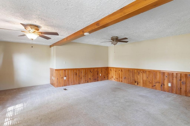 1620 Rainbow Lake Rd, Inman, SC 29349 - unfurnished room featuring a ceiling fan, a wainscoted wall, carpet flooring, a textured ceiling, and beamed ceiling