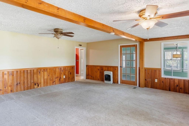 1620 Rainbow Lake Rd, Inman, SC 29349 - unfurnished living room with a wainscoted wall, ceiling fan, a textured ceiling, heating unit, and wood walls