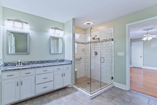 1620 Rainbow Lake Rd, Inman, SC 29349 - bathroom featuring double vanity, a shower stall, and ceiling fan