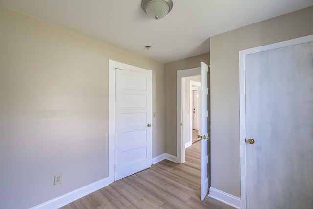 114 Woodrow St, Union, SC 29379 - unfurnished bedroom with baseboards and light wood-style flooring