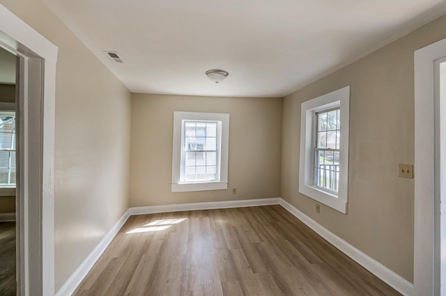 114 Woodrow St, Union, SC 29379 - spare room with plenty of natural light and wood finished floors
