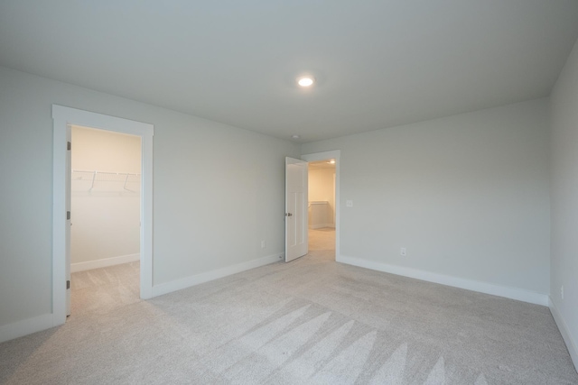 832 Redmill Ln, Duncan, SC 29334 - unfurnished bedroom featuring a spacious closet, light colored carpet, and a closet