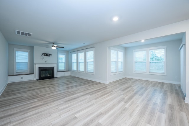 832 Redmill Ln, Duncan, SC 29334 - unfurnished living room with ceiling fan, a fireplace with flush hearth, healthy amount of natural light, light wood finished floors, and recessed lighting