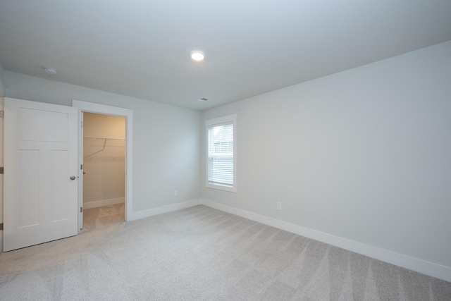 832 Redmill Ln, Duncan, SC 29334 - unfurnished bedroom featuring light colored carpet, a spacious closet, and a closet