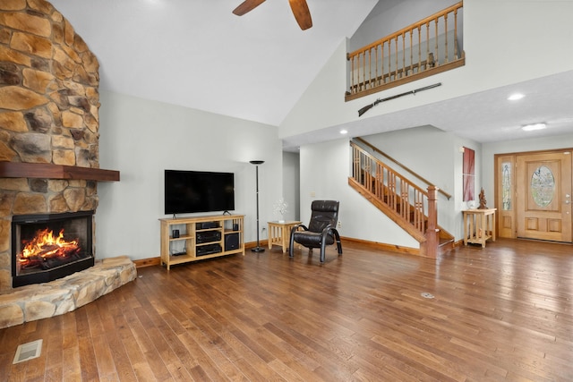 116 Dorothy Ln, Pickens, SC 29671 - living room featuring high vaulted ceiling, stairs, hardwood / wood-style flooring, ceiling fan, and a fireplace
