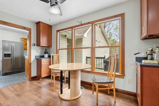 116 Dorothy Ln, Pickens, SC 29671 - kitchen featuring stainless steel refrigerator with ice dispenser, ceiling fan, brown cabinetry, and light wood-type flooring