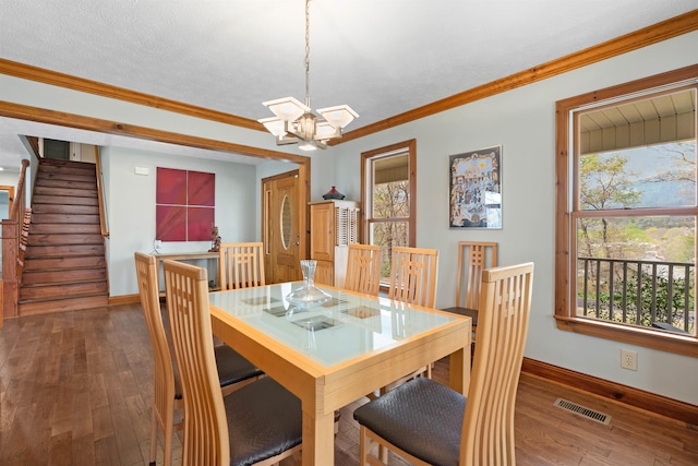116 Dorothy Ln, Pickens, SC 29671 - dining area featuring a chandelier, hardwood / wood-style floors, crown molding, plenty of natural light, and stairway
