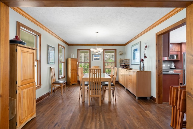 116 Dorothy Ln, Pickens, SC 29671 - dining space featuring a chandelier, dark wood-style flooring, ornamental molding, and a textured ceiling