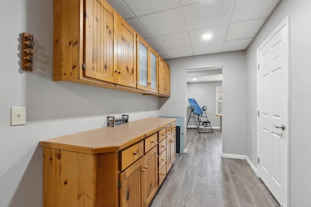 116 Dorothy Ln, Pickens, SC 29671 - kitchen featuring light wood-type flooring, light countertops, a paneled ceiling, brown cabinets, and recessed lighting
