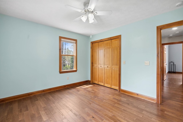 116 Dorothy Ln, Pickens, SC 29671 - unfurnished bedroom featuring wood finished floors, a closet, and a ceiling fan