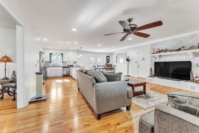 101 Owens Dr, Inman, SC 29349 - living area with light wood-type flooring, ceiling fan, recessed lighting, and a brick fireplace