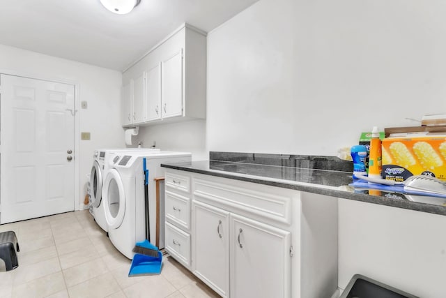 101 Owens Dr, Inman, SC 29349 - laundry area with washing machine and clothes dryer, light tile patterned flooring, and cabinet space