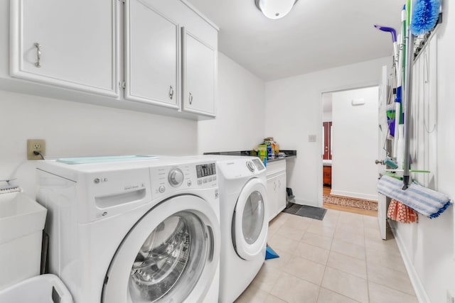 101 Owens Dr, Inman, SC 29349 - washroom with separate washer and dryer, cabinet space, and light tile patterned flooring